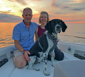 Bill & Sharon with their dog - a skilled paddleboarder!